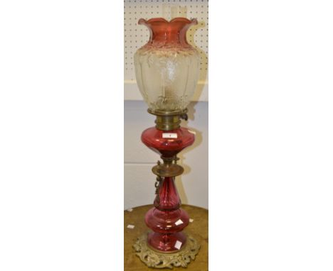 A Victorian Cranberry glass oil lamp c 1870