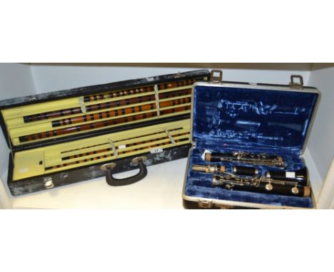 Musical Instruments - cased Kings clarinet; a set of Oriental carved bamboo flutes (2)