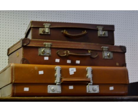 Vintage luggage - a leather suitcase; another similar; etc (3)