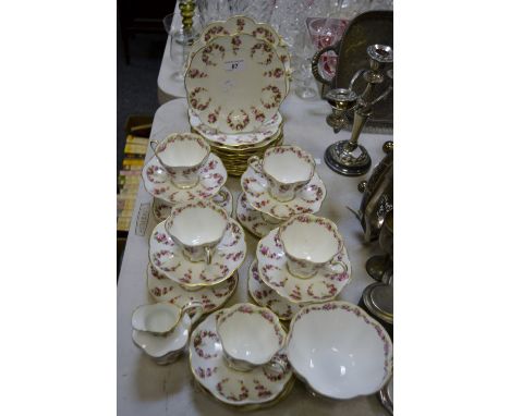 A comprehensive Crescent China tea service, decorated with cabbage roses