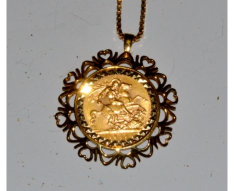 A George V sovereign, mounted, 9ct gold chain, 18.7g