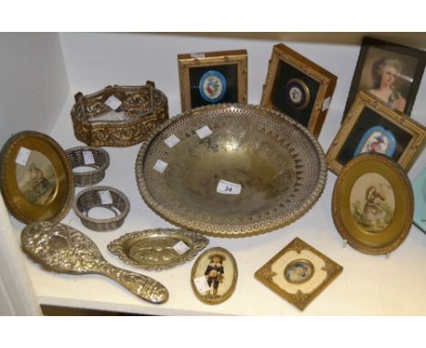 A silver coloured metal backed hairbrush; an EPNS  bowl, pierced border, silver coloured table salts, lacking liners; framed 