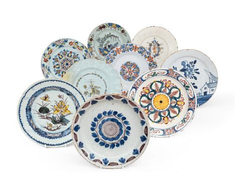 A GROUP OF EIGHT ENGLISH DELFT PLATES  18TH CENTURY     assorted polychrome decoration, mostly floral  largest 23cm diameter 