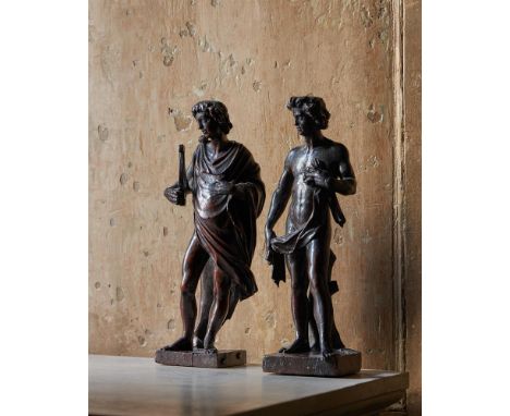 AFTER THE ANTIQUE AND MICHELANGELO, A RARE PAIR OF CARVED WOOD FIGURES OF DAVID AND APOLLO  FLEMISH, 17TH CENTURY  approximat