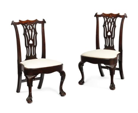 A PAIR OF GEORGE II MAHOGANY SIDE CHAIRS IN THE MANNER OF THOMAS CHIPPENDALE, CIRCA 1750 With gothic design splats 96cm high,