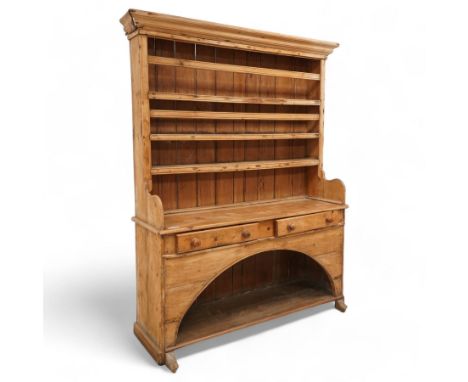 19th century stripped pine dresser, projecting moulded cornice over three shelves, fitted with two drawers, pot board base en