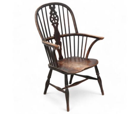 Early 19th century figured elm and ash Windsor chair, high hoop and stick back with pierced wheel splat over a shaped dished 