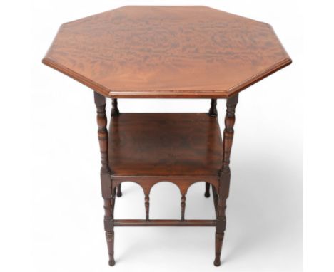 Arts & Crafts period mahogany centre table, octagonal moulded top on ring turned supports united by undertier, arched lower b