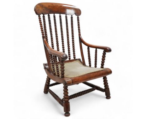 19th century simulated rosewood and stained beech framed armchair, shaped cresting rail over bobbin turned rails, on bobbin t