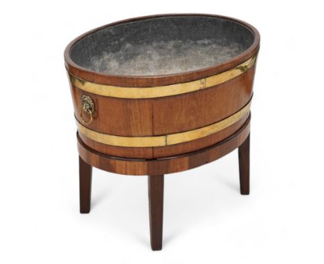George III Chippendale design brass bound mahogany wine cooler of oval form, the coopered body enclosed by two brass brands, 