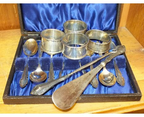 A cased set of silver teaspoons and sugar tongs, Sheffield 1942/43, four silver napkin rings and a silver-handled shoe horn a