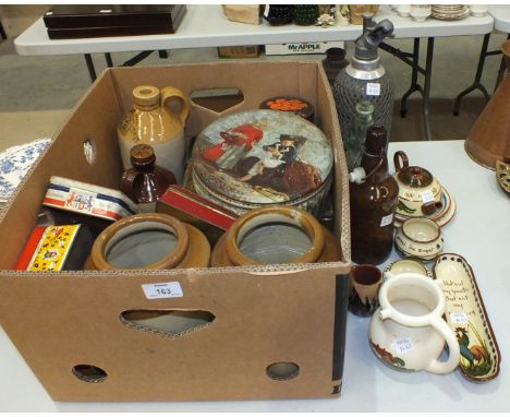 A collection of advertising tins, a soda siphon, various glass and ceramic jelly moulds, (a/f), other ceramics, glass etc.