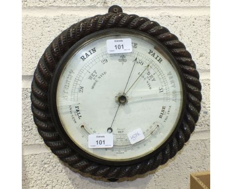 Reaumur, a circular barometer with thermometer in wooden rope-twist mount, 27cm diameter, (bezel a/f).