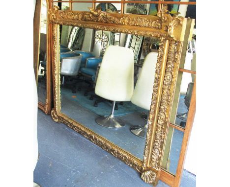 WALL MIRROR, with an elaborate gilt frame with a nesting bird surmount with scrolled detail and shell motif, 155cm x 136cm H.