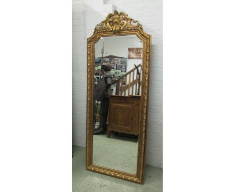 PIER MIRROR, Continental style gilt with an ornate leaf and scroll surmount and a bevelled plate, 76cm W x 192cm H.