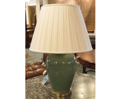 TABLE LAMP, with a green glaze crackle finish and gilt metal base with silk shade, overall 75cm H.