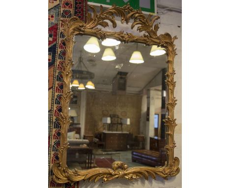 WALL MIRROR, mid 19th century giltwood and gesso with rectangular palm frond frame, 74cm W x 103cm H. (with faults)