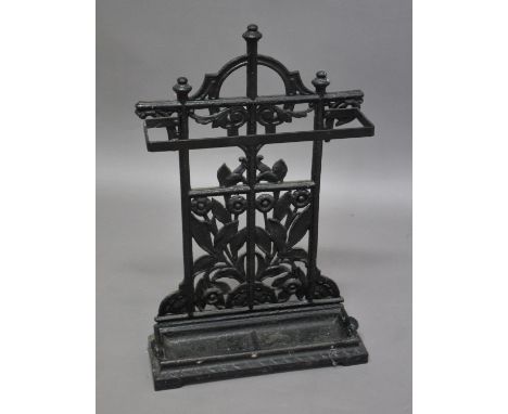 VICTORIAN CAST IRON STICK STAND a small cast iron stick stand, the back with a floral design and with a removable tray. Tray 