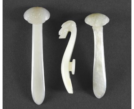 TWO SIMILAR CHINESE WHITE JADE RUYI SCEPTRE FORM HAIR ORNAMENTS Qing Dynasty, 19thc, each carved with a shou character to the