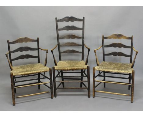 ERNEST GIMSON (1864-1919) - ARTS &amp; CRAFTS CHAIRS including a near pair of 'Pass chairs', the' ebonised ash armchairs with