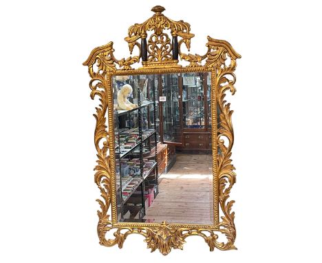 Chippendale style gilt framed bevelled wall mirror, 121cm by 78cm.