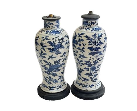 Pair of Chinese blue and white lamp bases with bird and floral decoration, 30cm.