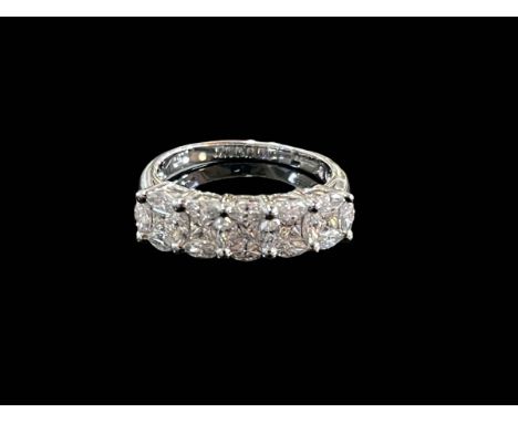 Impressive twenty one stone diamond ring, the square and oval diamonds set to give the impression of a five stone ring, in 18