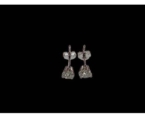 Pair of diamond stud earrings set in 18 carat white gold, diamond 1.12 carats.
