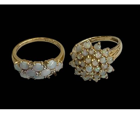 Two 9 carat gold opal rings.