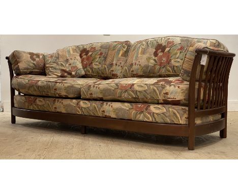 Ercol, a vintage three seat sofa, with spar sides and back, squab cushions, raised on turned supports. H