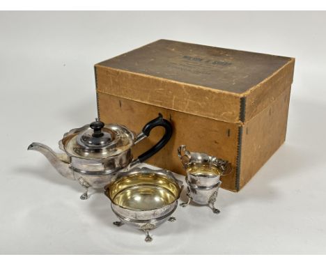 A Edwardian Wilson &amp; Sharp of Edinburgh silver three piece silver morning tea service comprising tea pot with ebony knop 