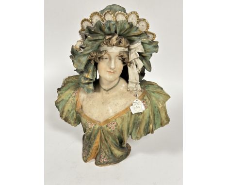 &nbsp;A 19thc Bohimia Turn Teputz porcelain bust of a lady with lace beribboned bonnet with green gilt bordered blouse with f