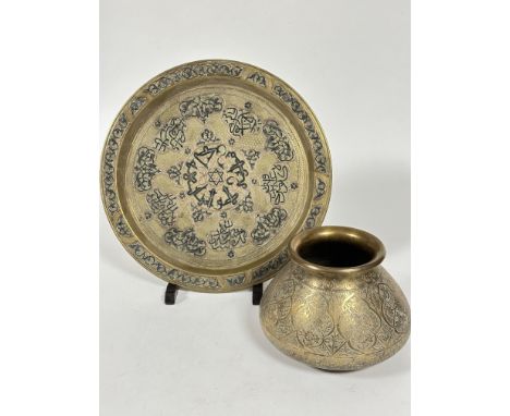 A late 19thc Middle Eastern style heavy brass black enamel and copper inlaid serving tray with and all over engraved lattice 