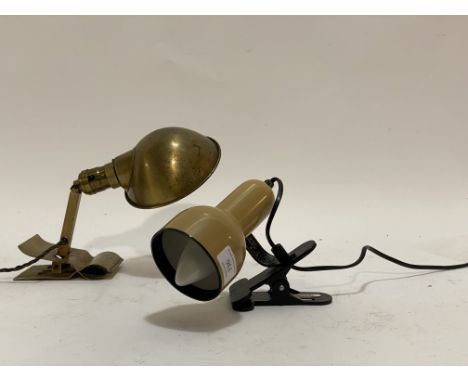 A vintage brass clip on reading light, inscribed Bryant Made in USA together with another clip on reading light. (2)