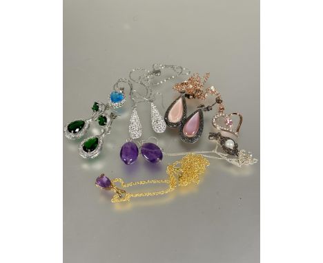 A collection of costume jewellery including a pair of green paste set pear shaped chandelier earrings, pair of oval amethyst 