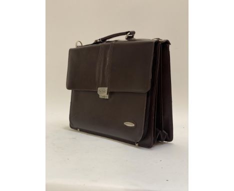 Pierre Cardin, a Vintage brown stitched leather briefcase, with carry handle and combination latch (0,0) and interior lined i