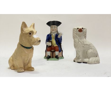 A Staffordshire style flatback chimney spaniel (H25cm) together with a 19th century pearlware Tobey jug, decorated in polychr