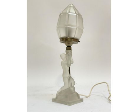 An Art Deco period frosted glass figural table lamp, formed as a semi nude lady holding a torch. H46cm.