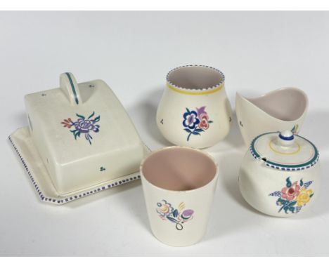 A Poole pottery butter dish and cover in the Art Deco style with hand painted floral sprays and curved handle to top H x 12cm
