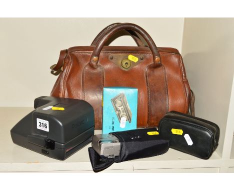 A SMALL LEATHER GLADSTONE BAG, containing cameras and field glasses, these include a pair of James Luckins and Co of Birmingh