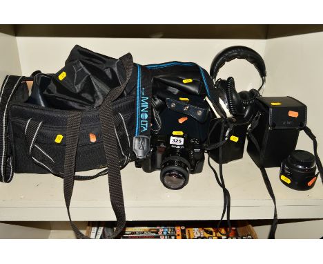 A TRAY OF CAMERAS AND EQUIPMENT, including a Minolta 700Si film camera fitted with a 35-70mm f3.5 lens, a Sigma 75-300mm f4 ,