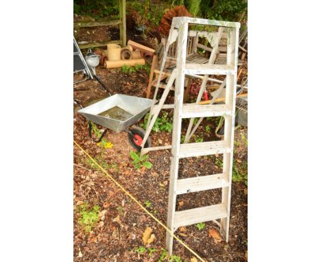 AN ALUMINIUM STEP LADDER, together with a galvanised wheelbarrow (2)