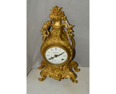 AN ITALIAN 'IMPERIAL' BRASS CASED MANTEL CLOCK OF ROCOCO STYLE, enamel dial with Roman numerals, German eight day movement wi