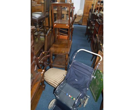 A DISTRESSED CIRCULAR LEATHER POUFFE together with a formica table, two pine chairs, Silver Cross pram, oak tea trolley, two 