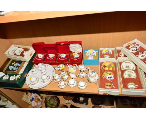 A GROUP OF VARIOUS MINIATURE TEAWARES, to include boxed Coalport fruit decorated trio by Norman Lear, three boxed sets of 'Ho