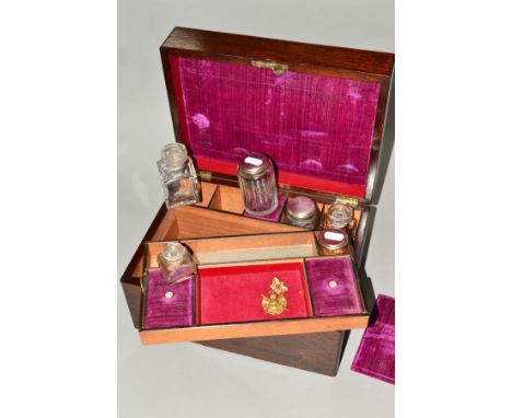 A VICTORIAN ROSEWOOD DRESSING BOX OF RECTANGULAR FORM, mother of pearl cartouche and escutcheon, fitted interior, lacks mirro