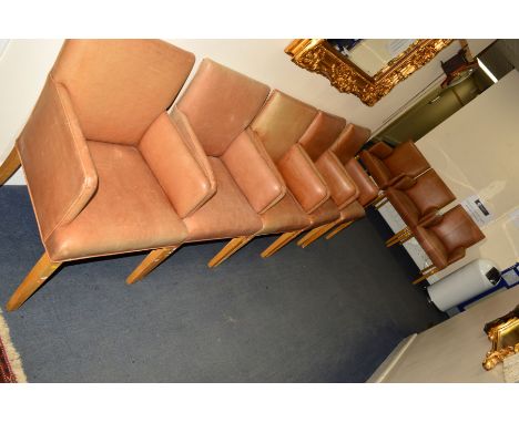 A SET OF EIGHT LIGHT BROWN LEATHER ARMCHAIRS