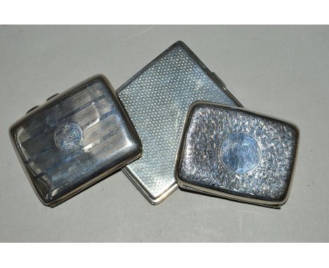 THREE SILVER CIGARETTE CASES, comprising a George V rectangular example, engine turned decoration, the worn gilded interior e