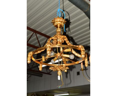 A LATE 20TH CENTURY ORMOLU CEILING LIGHT FITTING, urn shaped hanging fitting above six husk swags holding the circular fittin