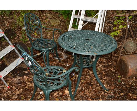 A GREEN PAINTED ALUMINIUM CIRCULAR GARDEN TABLE, two chairs and a Victorian garden roller (4)